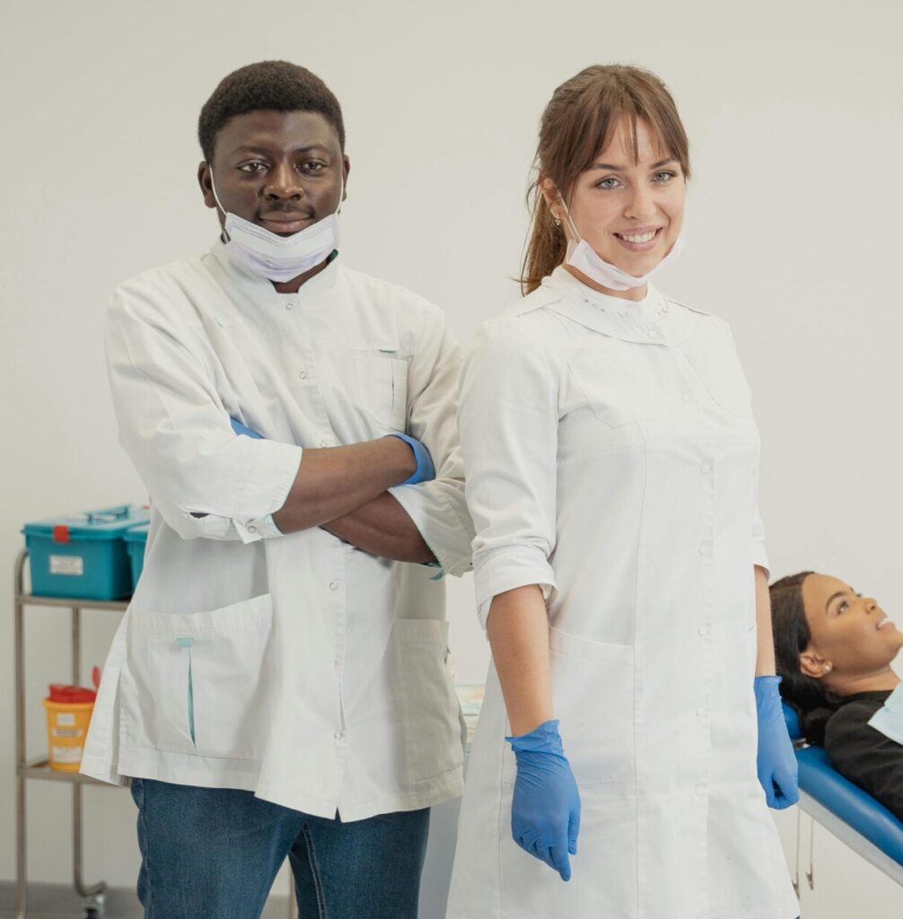 Dentists with patient in a dental clinic providing healthcare services.